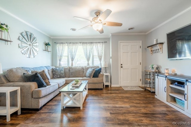 living room with ornamental molding, ceiling fan, and dark wood-type flooring