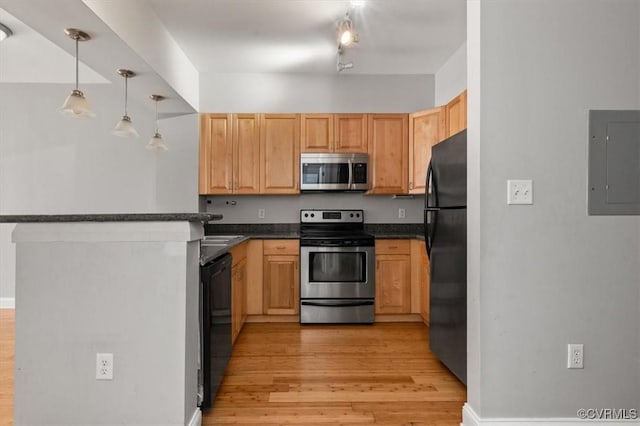 kitchen with stainless steel appliances, electric panel, light wood-type flooring, and dark countertops