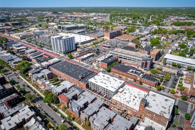 aerial view of property and surrounding area featuring nearby urban area
