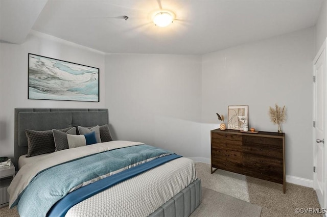 carpeted bedroom with baseboards