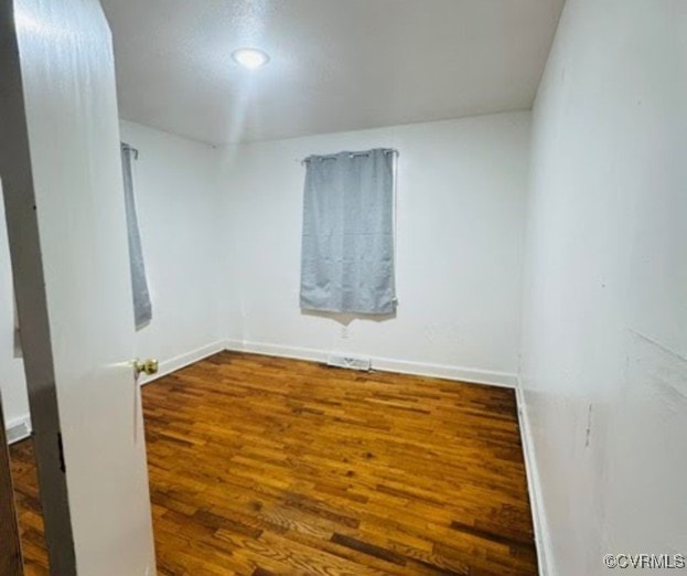 705 Endly St, Chase City, VA 23924 - unfurnished room featuring wood finished floors and baseboards
