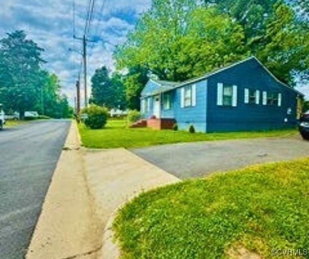 705 Endly St, Chase City, VA 23924 - view of side of home with a yard and asphalt driveway
