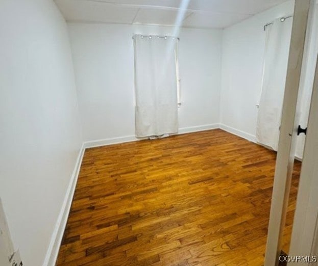705 Endly St, Chase City, VA 23924 - unfurnished room with wood finished floors and baseboards