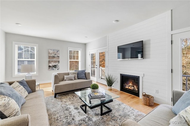 9475 Creek Summit Cir, Richmond, VA 23235 - living area with a large fireplace, plenty of natural light, and wood finished floors