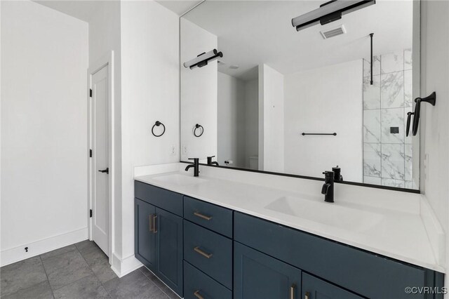 9475 Creek Summit Cir, Richmond, VA 23235 - bathroom with double vanity, a shower stall, and baseboards