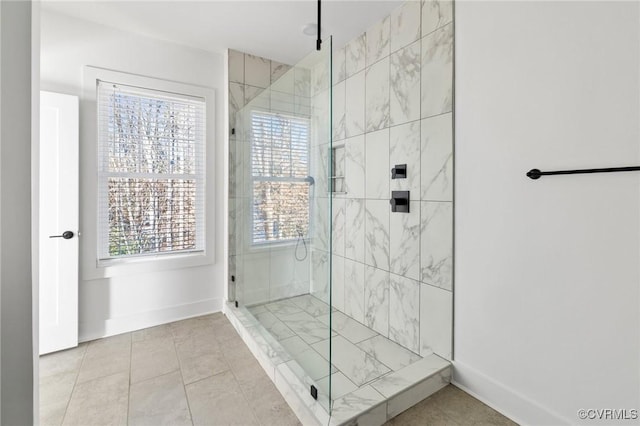 9475 Creek Summit Cir, Richmond, VA 23235 - bathroom featuring plenty of natural light, a shower stall, baseboards, and tile patterned floors
