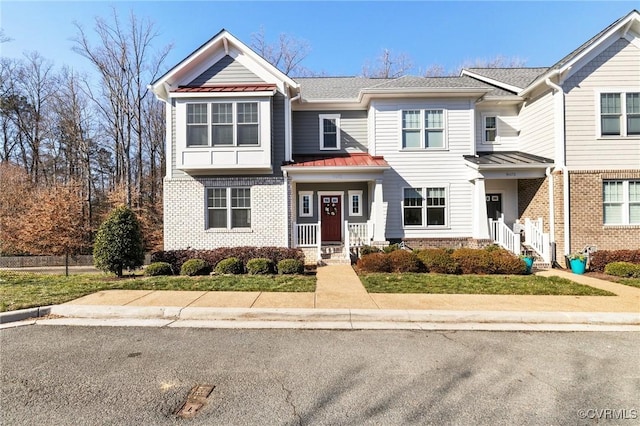 9475 Creek Summit Cir, Richmond, VA 23235 - multi unit property featuring a standing seam roof, brick siding, and metal roof