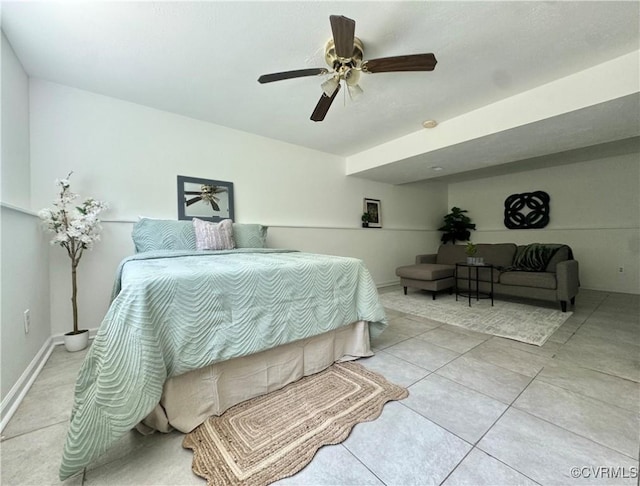 bedroom with ceiling fan and tile patterned flooring
