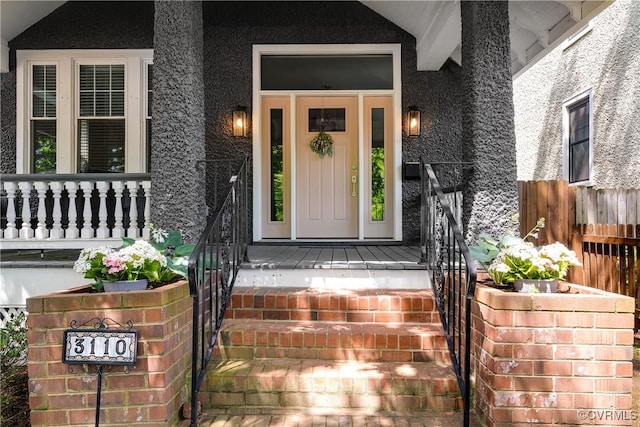 entrance to property with a porch