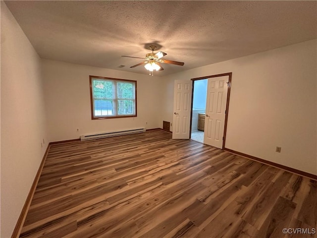 unfurnished bedroom featuring a baseboard heating unit, wood finished floors, baseboards, a textured ceiling, and a ceiling fan