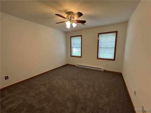 empty room featuring baseboard heating, dark carpet, ceiling fan, baseboards, and a textured ceiling