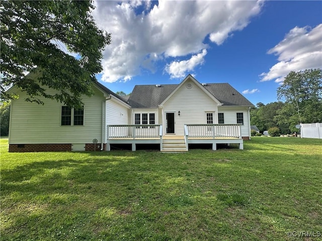 rear view of property featuring crawl space, a lawn, and a wooden deck