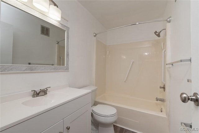 bathroom featuring toilet, bathing tub / shower combination, and vanity