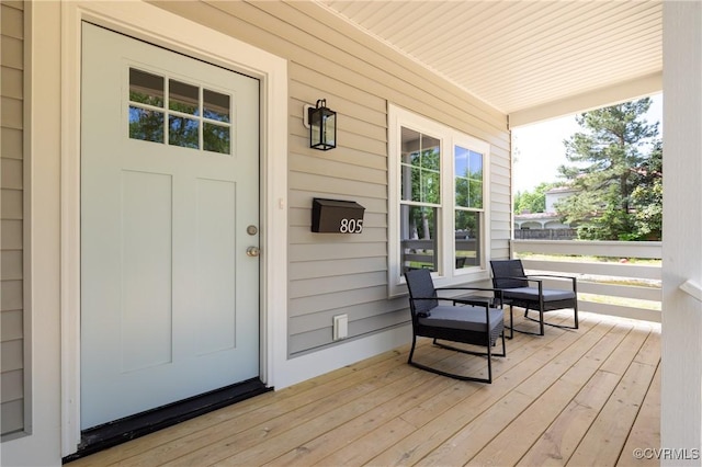 wooden terrace with covered porch