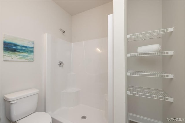 full bath featuring a shower and toilet