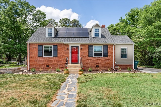 cape cod house with solar panels, a front lawn, crawl space, and roof with shingles