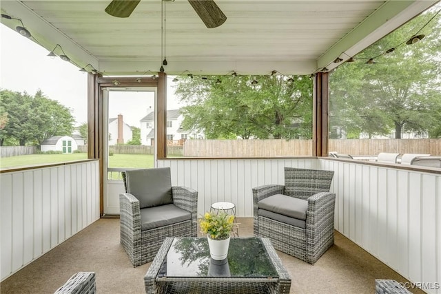 sunroom / solarium with ceiling fan
