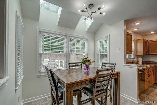 dining area with a chandelier and baseboards