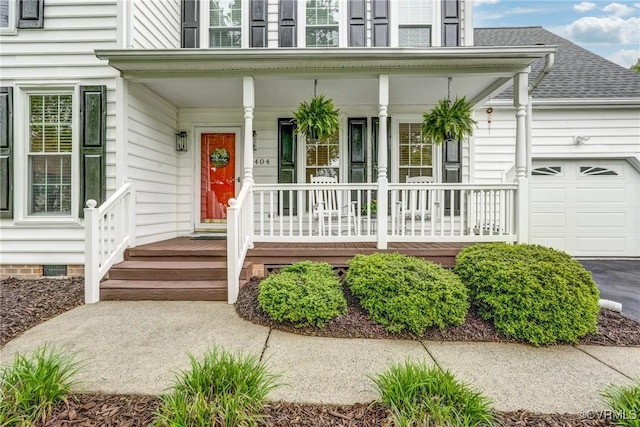 property entrance featuring a porch, a garage, a shingled roof, and crawl space