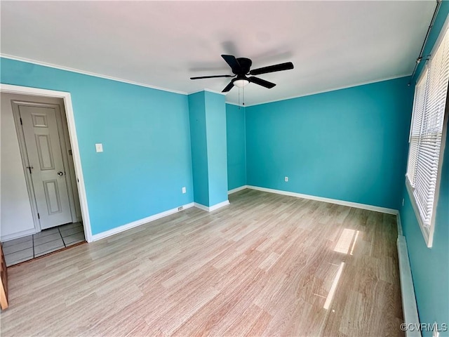8920 Richard Ln, Rice, VA 23966 - spare room featuring ceiling fan, baseboard heating, wood finished floors, baseboards, and crown molding
