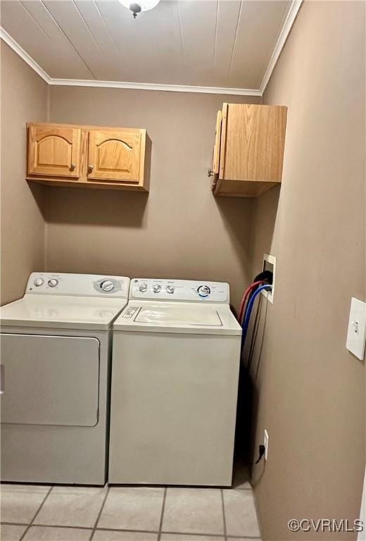 8920 Richard Ln, Rice, VA 23966 - clothes washing area featuring cabinet space, ornamental molding, washer and dryer, and light tile patterned floors