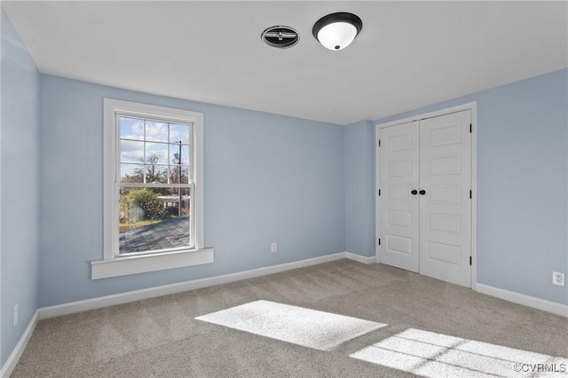 13130 The Glebe Ln, Charles City, VA 23030 - unfurnished bedroom with carpet floors, a closet, and baseboards