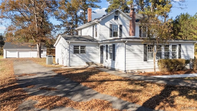 13130 The Glebe Ln, Charles City, VA 23030 - traditional-style home featuring a chimney, central AC unit, and an outdoor structure