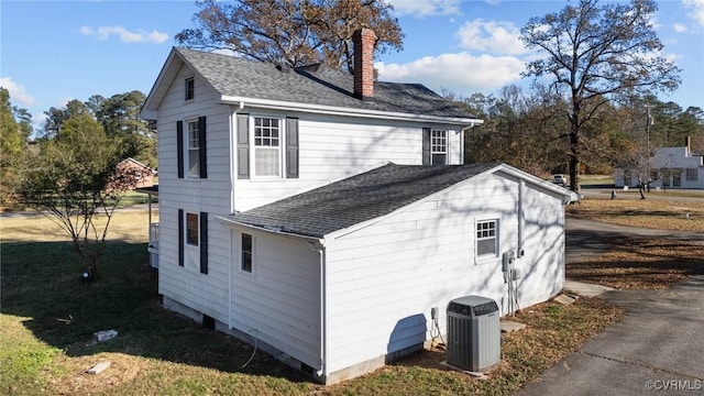 13130 The Glebe Ln, Charles City, VA 23030 - view of home's exterior featuring a chimney, roof with shingles, and central air condition unit