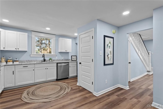 13130 The Glebe Ln, Charles City, VA 23030 - kitchen featuring stainless steel dishwasher, a sink, dark wood finished floors, white cabinetry, and recessed lighting