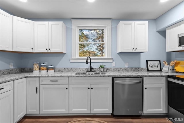 13130 The Glebe Ln, Charles City, VA 23030 - kitchen with appliances with stainless steel finishes, a sink, white cabinets, and light stone countertops