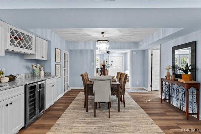 13130 The Glebe Ln, Charles City, VA 23030 - dining room featuring beverage cooler, a chandelier, a bar, and dark wood-type flooring