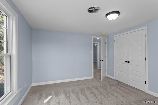 13130 The Glebe Ln, Charles City, VA 23030 - unfurnished bedroom featuring carpet flooring, baseboards, and a closet