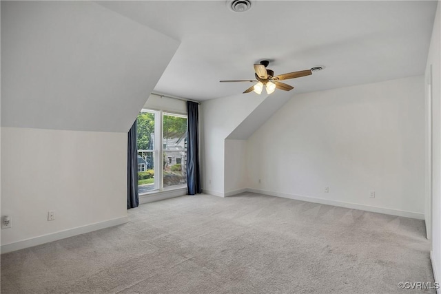 bonus room with vaulted ceiling, carpet, ceiling fan, and baseboards