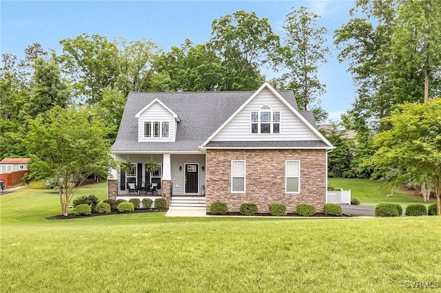 10527 Deerlake Dr, New Kent, VA 23124 - view of front of property featuring stone siding, a front yard, a porch, and a shingled roof
