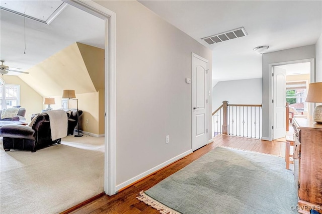10527 Deerlake Dr, New Kent, VA 23124 - hallway featuring attic access, healthy amount of natural light, wood finished floors, and lofted ceiling