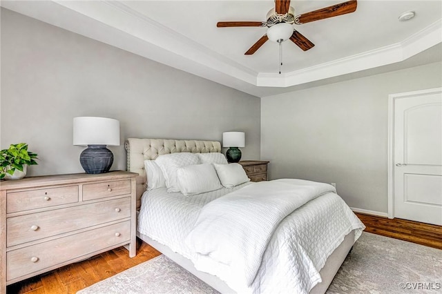 10527 Deerlake Dr, New Kent, VA 23124 - bedroom featuring light wood-style flooring, a raised ceiling, ornamental molding, and ceiling fan