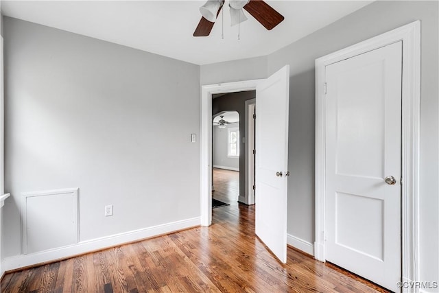 2704 Carlisle Ave, Henrico, VA 23231 - unfurnished bedroom with wood finished floors, baseboards, and ceiling fan