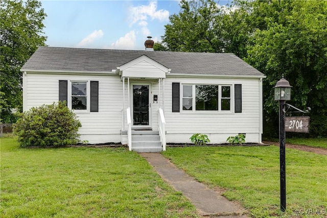2704 Carlisle Ave, Henrico, VA 23231 - bungalow-style house featuring a chimney, a front lawn, and a shingled roof