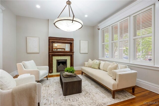 2706 W Grace St, Richmond, VA 23220 - living area featuring baseboards, wood finished floors, recessed lighting, and a fireplace with raised hearth