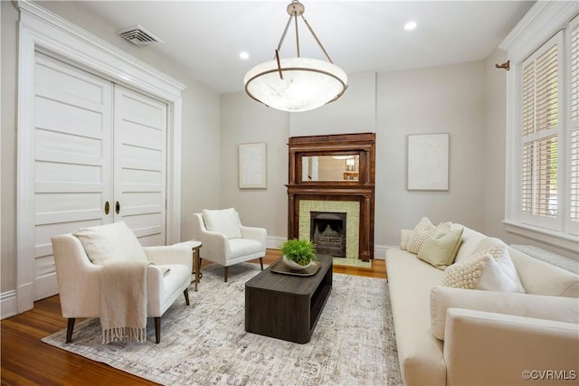 2706 W Grace St, Richmond, VA 23220 - living room featuring wood finished floors, baseboards, recessed lighting, and a fireplace with raised hearth