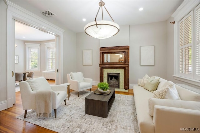 2706 W Grace St, Richmond, VA 23220 - living area featuring radiator, wood finished floors, plenty of natural light, recessed lighting, and baseboards