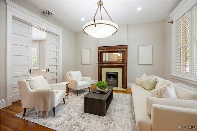 2706 W Grace St, Richmond, VA 23220 - living room with wood finished floors, plenty of natural light, a brick fireplace, and recessed lighting