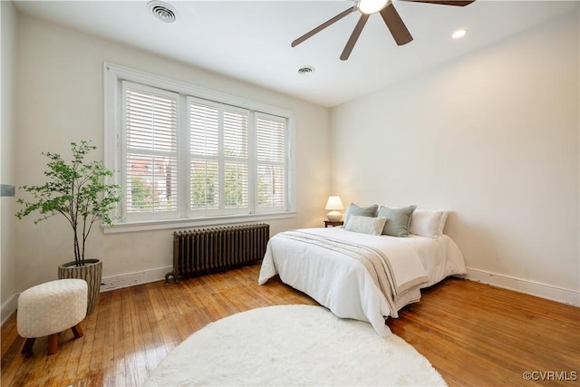2706 W Grace St, Richmond, VA 23220 - bedroom with radiator heating unit, baseboards, wood-type flooring, recessed lighting, and ceiling fan