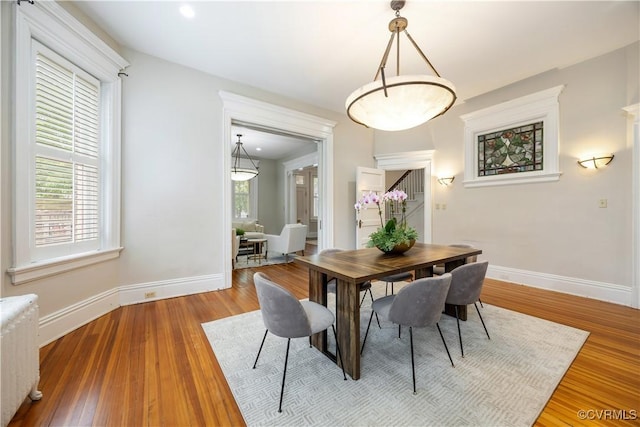 2706 W Grace St, Richmond, VA 23220 - dining area featuring radiator heating unit, baseboards, and wood finished floors