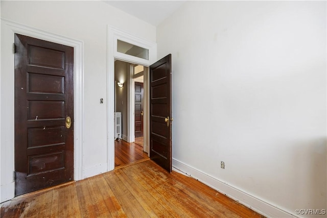 2706 W Grace St, Richmond, VA 23220 - unfurnished bedroom featuring light wood-type flooring and baseboards
