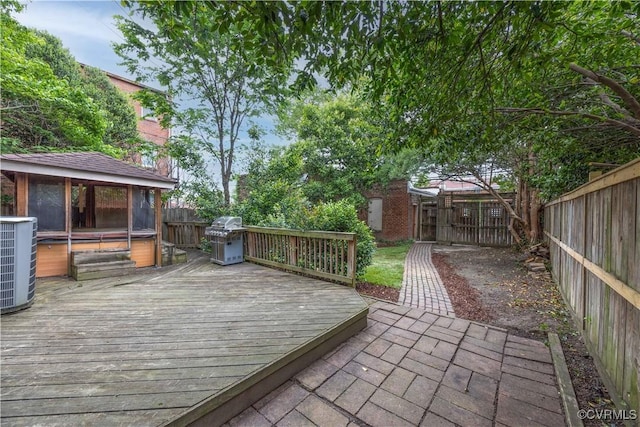 2706 W Grace St, Richmond, VA 23220 - deck with a hot tub, central AC, a fenced backyard, and a grill