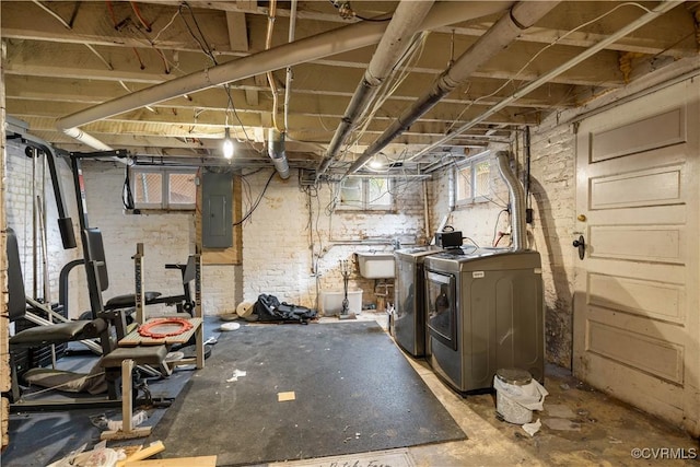 2706 W Grace St, Richmond, VA 23220 - basement featuring washing machine and dryer, electric panel, and a sink