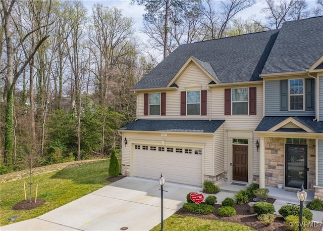 5801 Riverside Trl, Richmond, VA 23225 - view of front facade with a garage, driveway, a shingled roof, a front lawn, and stone siding