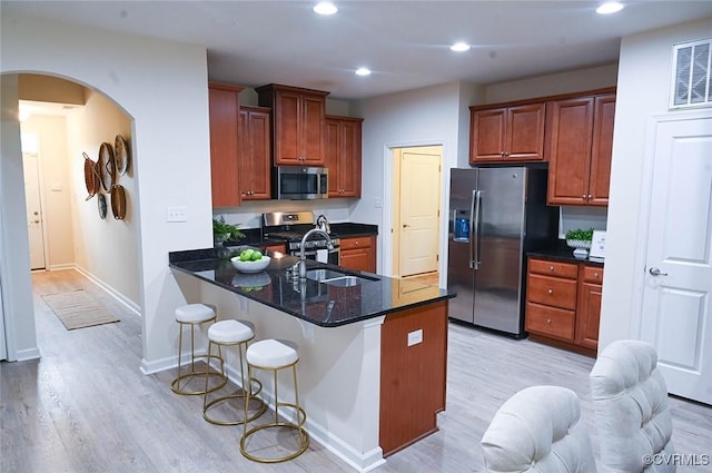 5801 Riverside Trl, Richmond, VA 23225 - kitchen featuring stainless steel appliances, light wood-style flooring, a breakfast bar, a peninsula, and recessed lighting