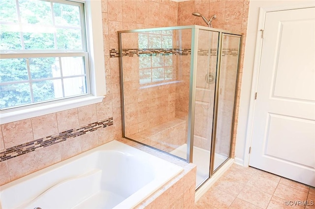 5801 Riverside Trl, Richmond, VA 23225 - bathroom featuring a stall shower, healthy amount of natural light, a bath, and tile patterned flooring